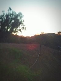 Scenic view of landscape against sky at sunset