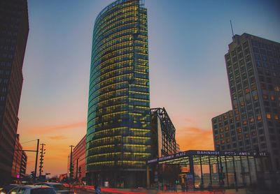 Low angle view of buildings against sky during sunset