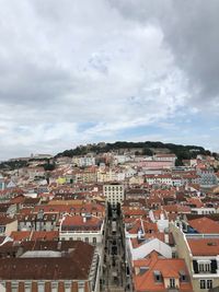 High angle view of buildings in town against sky