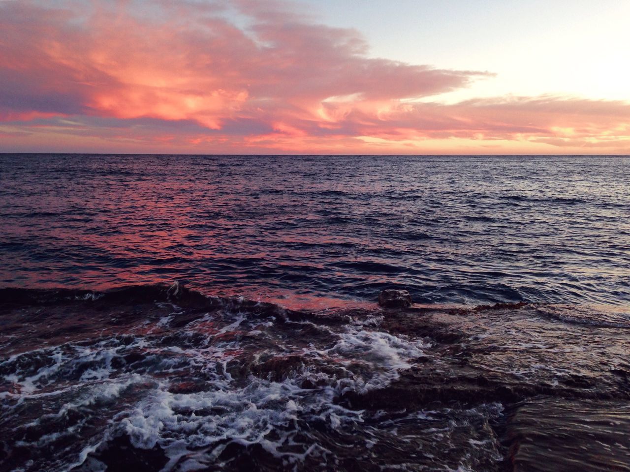 sea, water, sunset, horizon over water, scenics, tranquil scene, beauty in nature, sky, tranquility, nature, idyllic, seascape, rippled, orange color, cloud - sky, wave, rock - object, cloud, remote, dramatic sky