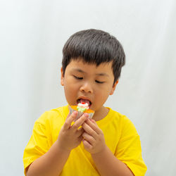 Cute boy eating food