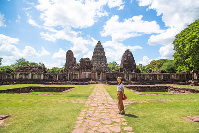 Woman standing against temple