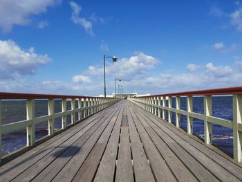 Pier over sea against sky