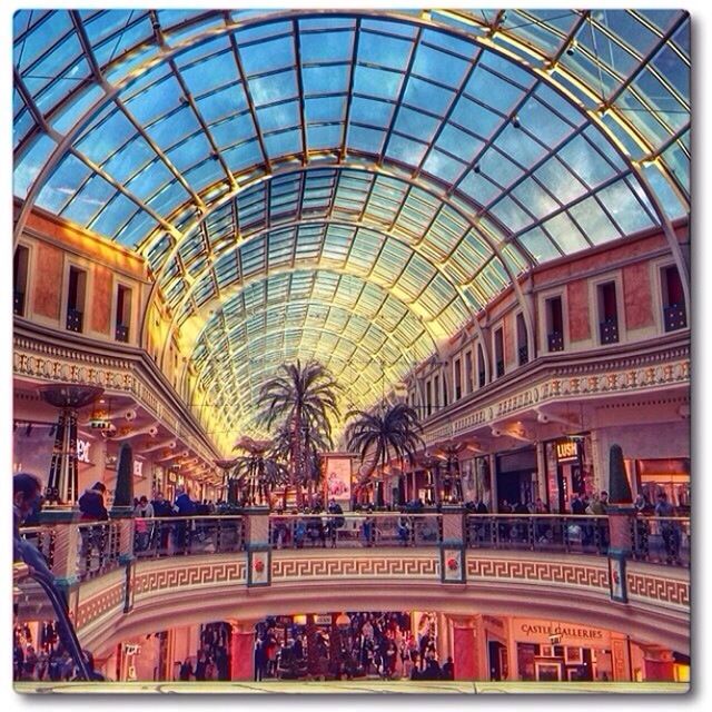 architecture, built structure, indoors, ceiling, railroad station, transfer print, shopping mall, public transportation, large group of people, glass - material, building exterior, incidental people, modern, city, city life, rail transportation, railroad station platform, men, auto post production filter