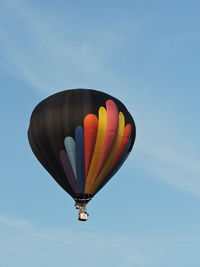 Low angle view of hot air balloon flying in sky