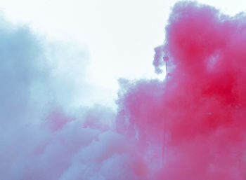 Low angle view of smoke against sky