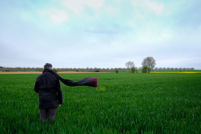 Rear view of man on field