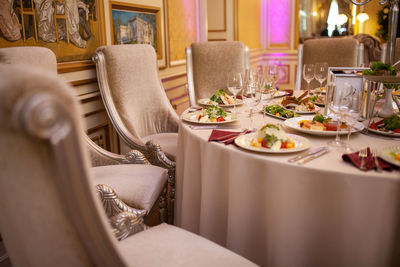 Table in the restaurant with food dishes.