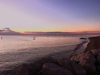 Scenic view of sea at sunset