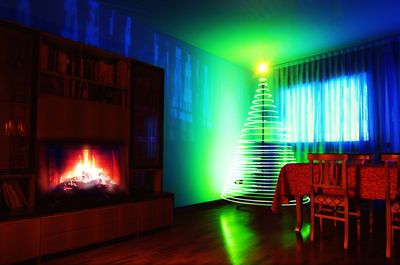 Empty chairs and tables in illuminated room