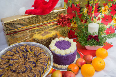 High angle view of christmas decorations and a purple yam cake