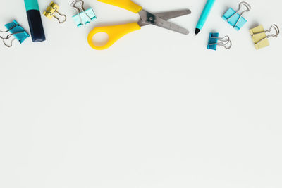 High angle view of colored pencils on white background