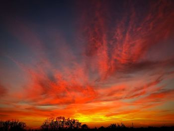 Low angle view of dramatic sky during sunset