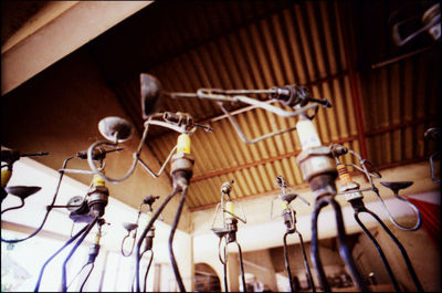 Close-up of lighting equipment hanging on ceiling