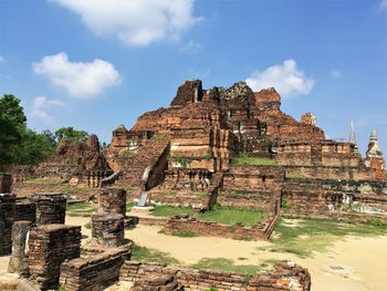 Old ruins of temple against cloudy sky