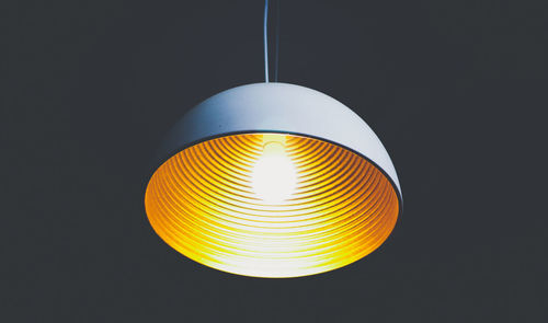 Low angle view of lit light bulb