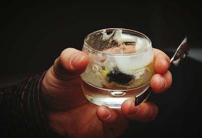 Close-up of hand holding wineglass