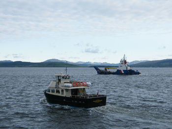 Ship in sea against sky