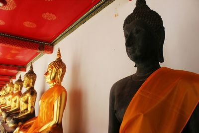 Rear view of buddha statue in temple