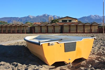 Lifeguard hut on beach against clear sky