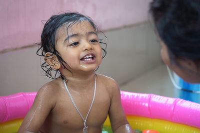 Portrait of a smiling girl in swimming pool