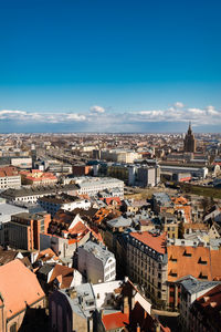 High angle view of townscape against blue sky