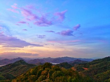 Scenic view of mountains against sky at sunset