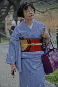 Full length of woman standing outdoors