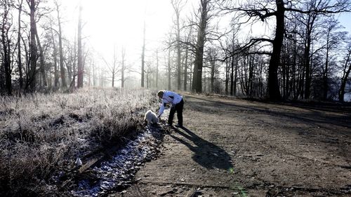 Full length of woman walking on landscape