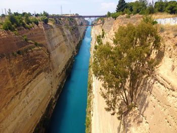 High angle view of river amidst trees against sky