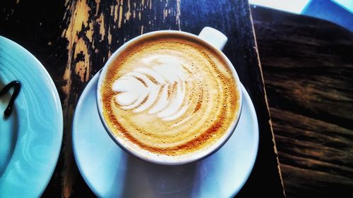Close-up of cappuccino on table