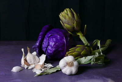 Close-up of food on table against black background