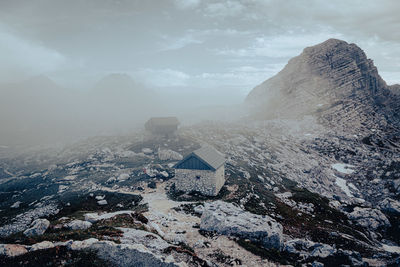 Aerial view of snowcapped mountains against sky