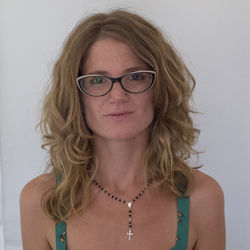 Portrait of young woman against white background