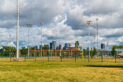 View of soccer field against cloudy sky