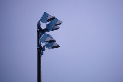 Low angle view of street light against clear blue sky