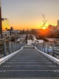 Street against sky during sunset
