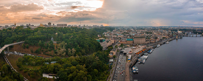 Sunset over summer kiev with arch of friendship of peoples.