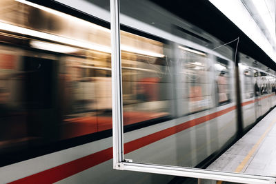 Blurred motion of train at railroad station