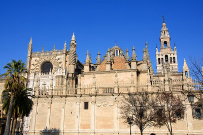 Low angle view of building against blue sky