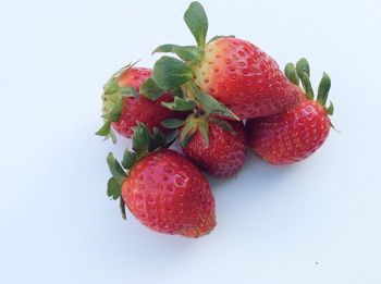 Close-up of strawberry over white background