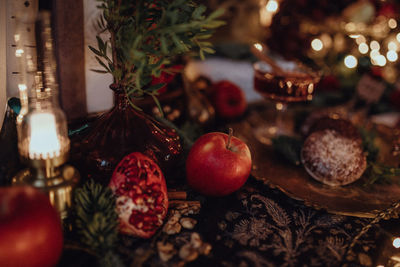 Christmas academia vintage harry potter table - fir, candles, wine, red decor, glasses, gingerbread