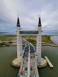 Bridge over sea against sky