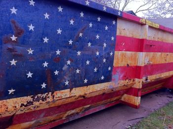 Low angle view of flags on wood