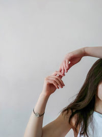 Portrait of woman against white background