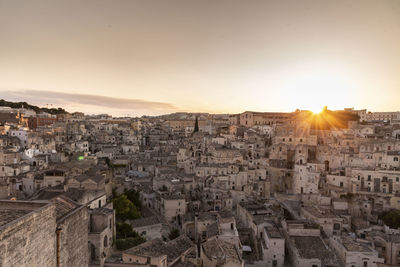 High angle shot of townscape against sky at sunset