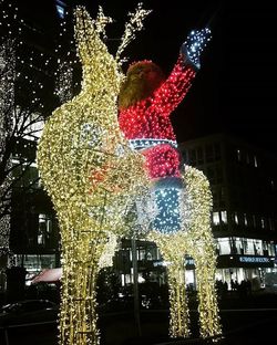 Low angle view of illuminated christmas tree