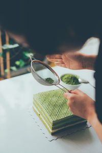 Midsection of woman preparing food at home