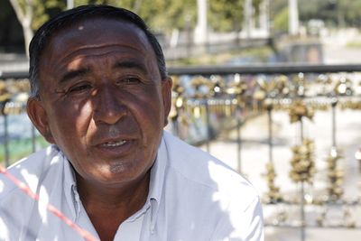 Close-up of mature man looking away during sunny day