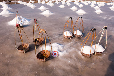 High angle view of basket with salt on land